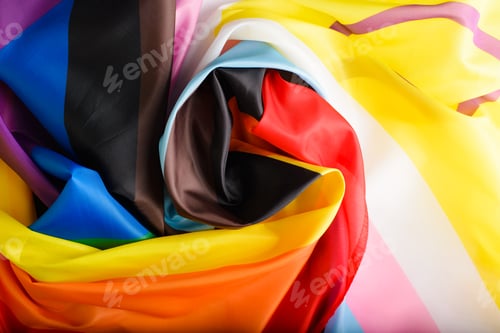 Preview: Top view rainbow flag, new international symbol of LGBTQ+ community in shape of spiral. Diversity