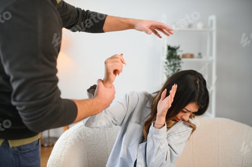 Preview: An agitated and upset husband shouts and looks at his wife, a quarrel between spouses.