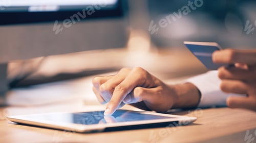 Preview: Hands, tablet and credit card for ecommerce, online shopping or banking at night on office desk. Ha