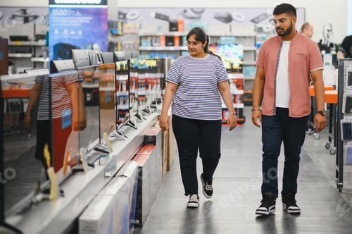 Preview: Couple in shopping. They are looking for a new tv