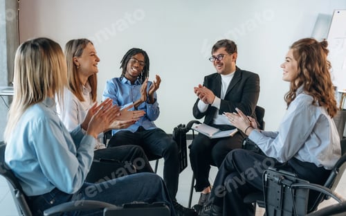 Preview: Applauding together. People are in group psychological support room