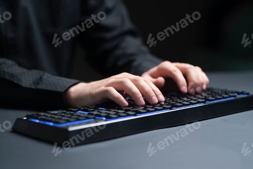Preview: a person on his work place typing on the keyboard