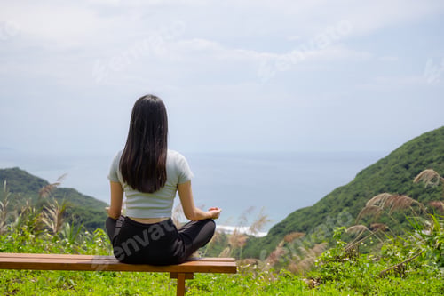 Preview: Woman practice meditation yoga at outdoor