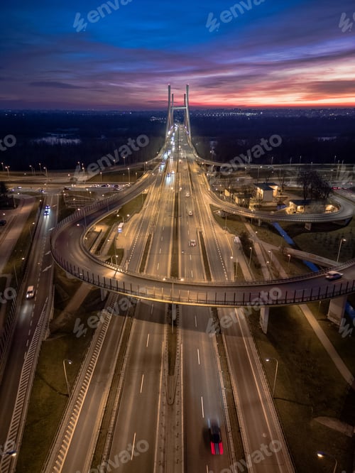 Preview: A busy intersection, with multiple cars and cyclists passing through, Warsaw, Poland