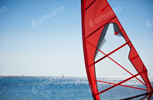 Preview: Windsurfing sail close up against blue sea and sky
