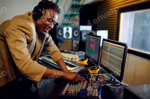 Preview: Male dj listening a record, recording studio