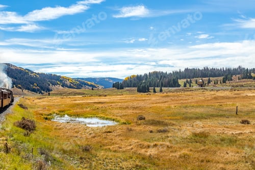 Preview: Beautiful Mountain Scenery With Streams, Valleys, And Color Changing Trees Along A Train Route From
