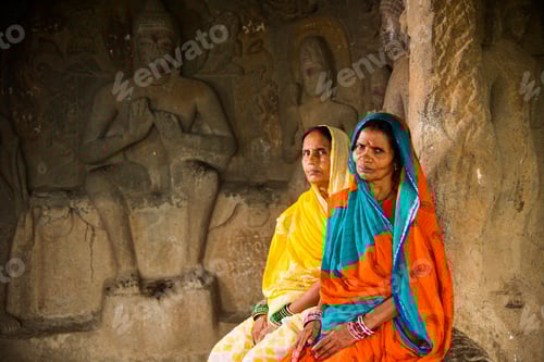 Preview: Women in buddha ancient cave, India.