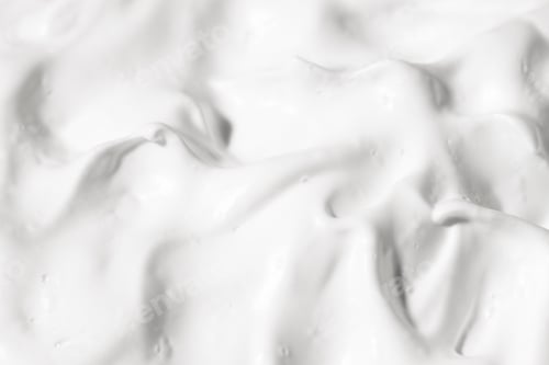 Preview: Texture of white cosmetic cream top view. Facial lotion, skin care pattern, beauty.