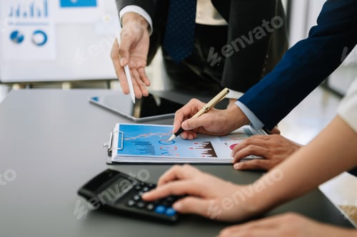 Preview: Business team on office table with smart phone and calculator digital tablet and graph business