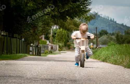 Preview: Boy has great fun riding a balance bike while learning to balance on a bike