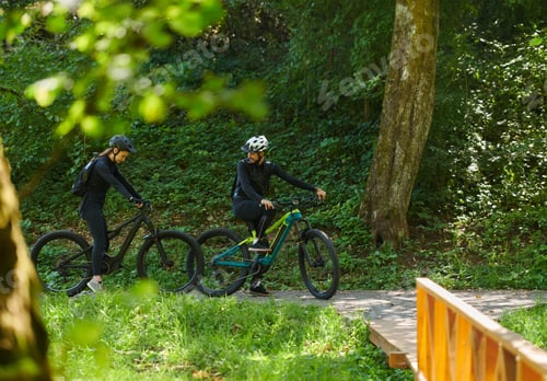 Preview: A blissful couple, adorned in professional cycling gear, enjoys a romantic bicycle ride through a