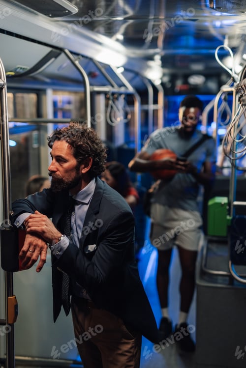 Vista previa: Businessman waiting on the bus while basketball player stands nearby