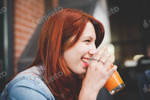 Preview: Young redhead woman outdoor