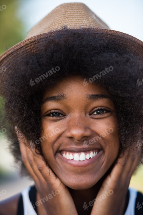 Preview: Close up portrait of a beautiful young african american woman sm