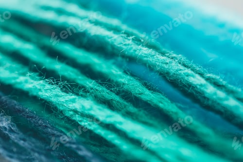 Preview: close up view of blue and green knitting yarn ball