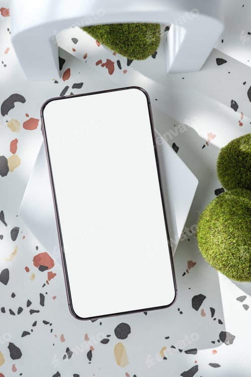 Preview: mobile phone on white geometric pedestal on terrazzo background with summer sunlight and moss rock