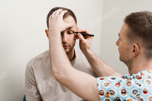 Preview: Professional male eyelid surgery markings before cosmetic blepharoplasty operation
