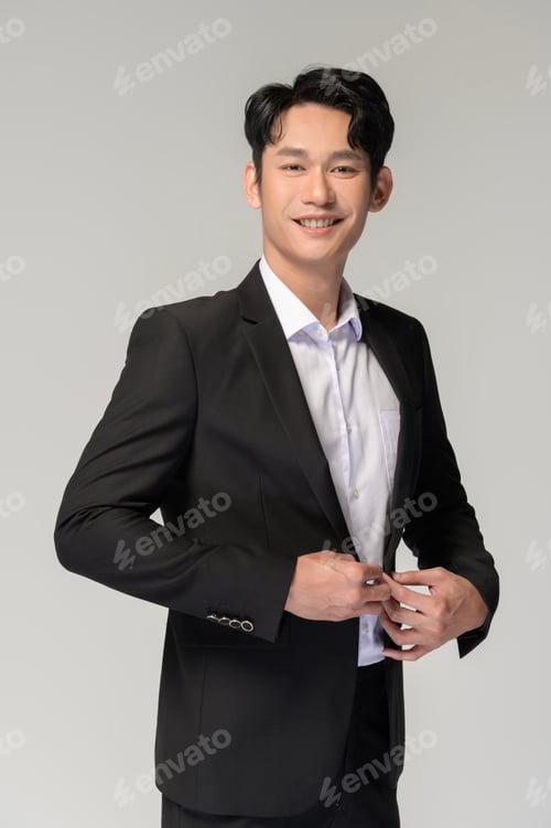 Preview: Portrait of Happy asian man wearing suit over white background