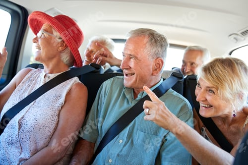 Preview: Group Of Senior Friends Sitting In Back Of Van Being Driven To Vacation
