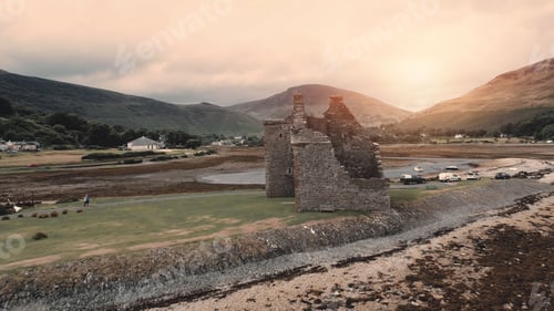 Preview: Sun closeup castle ruins aerial. Historical architecture attraction at sea bay. Historic monument