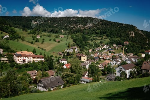 Preview: Summer view of a beautiful apline village in Switzerland
