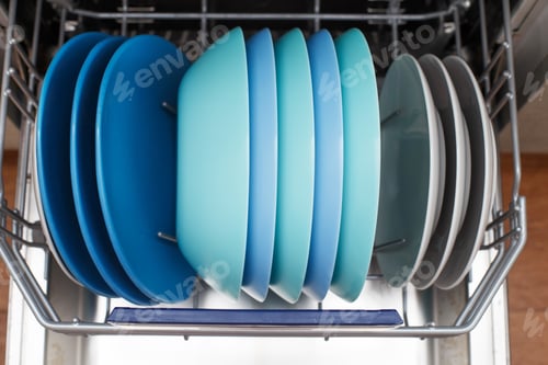 Preview: Open dishwasher with a clean dishes in the kitchen