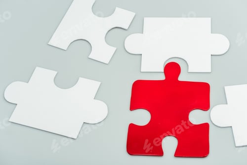 Preview: red and white jigsaw pieces isolated on grey