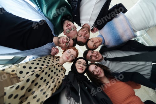 Preview: A diverse group of business professionals standing together in a powerful, united pose, captured