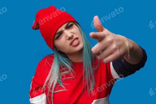Preview: Displeased woman pointing at camera