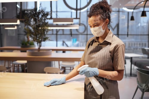 Preview: Asian Woman Cleaning Table in Food Court