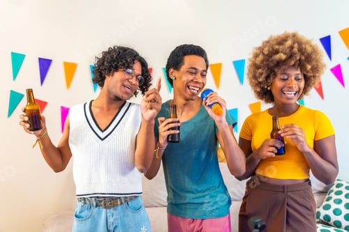 Preview: Happy multi-ethnic friends singing karaoke at home