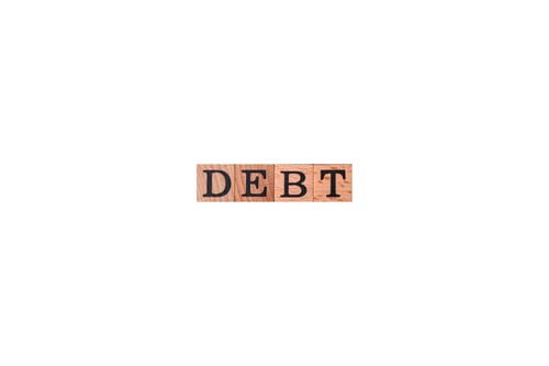 Preview: The inscription Debt inspection made of wooden cubes on a plain background