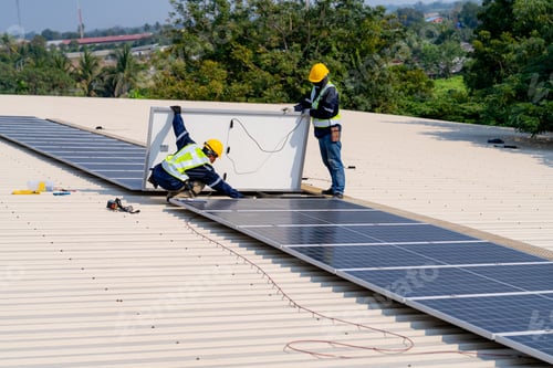 Preview: workers installing solar panels, for efficient energy on rooftop