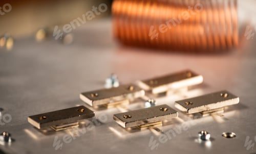 Preview: Close-up of five metal plates on a large iron case