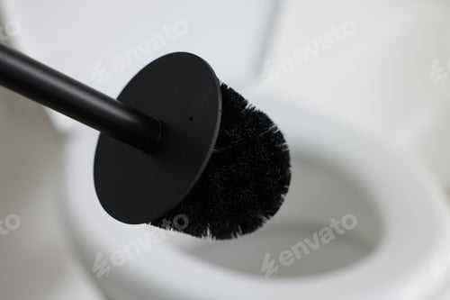 Preview: Black toilet brush and bowl indoors, selective focus