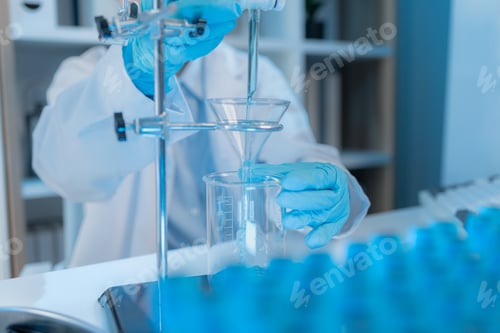 Preview: A chemistry researcher in a laboratory surrounded by scientific equipment and test tubes