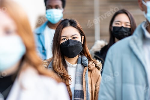 Preview: Multiracial people in the city wearing face mask