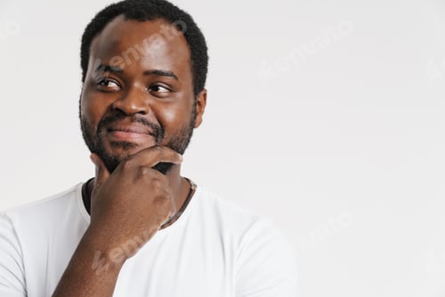 Preview: Black bristle man smiling while holding his chin