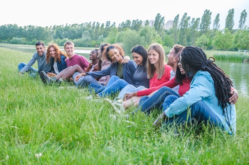 Preview: Heterogeneous group of young people from different origins enjoying an afternoon outdoors