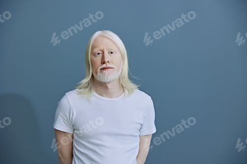 Preview: portrait of a middle aged man with long blonde hair and a beard, dressed in a white t shirt