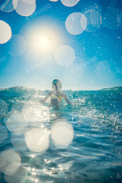 Preview: Happy child playing in the sea