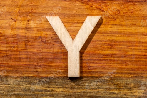 Preview: Wooden letters Y on wooden background, top view