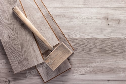Preview: Laminate wood floor and wooden hammer tool. Laminate flooring