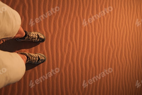 Preview: Tourist walking on the erg chebbi dunes in merzouga desert, morocco