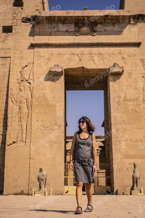 Preview: A young tourist at the entrance to the Edfu Temple near the Nile River in Aswan