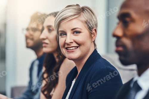 Preview: Smiling Woman in a Business Meeting with Colleagues