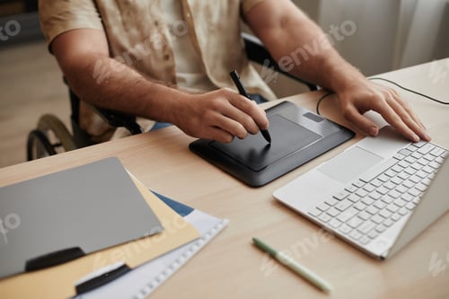Preview: Close Up of Man Using Pen Tablet Editing Photos or Video at Home Office