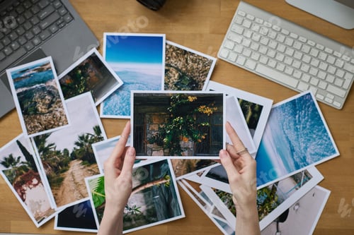 Preview: Photographer examining photos at her workplace