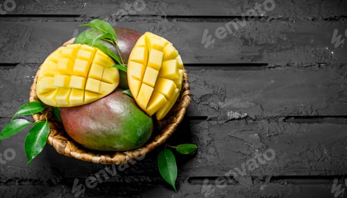 Preview: Aromatic fresh mango in a basket.